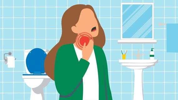 Person with sore throat, standing in their bathroom at home