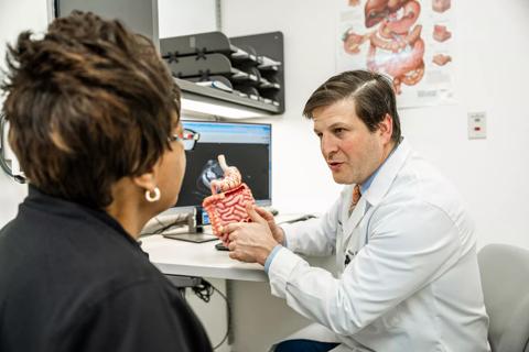 Dr. Sommovilla speaking with patient