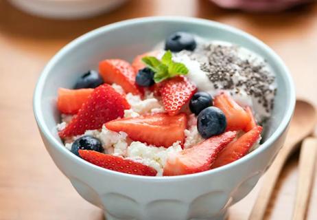 A bowl of cottage cheese topped with berries