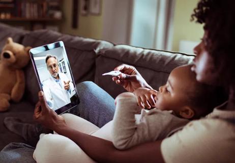 Mom with sick baby virtual appointment with doctor