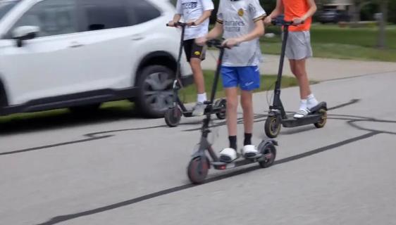 Kids riding electric scooters