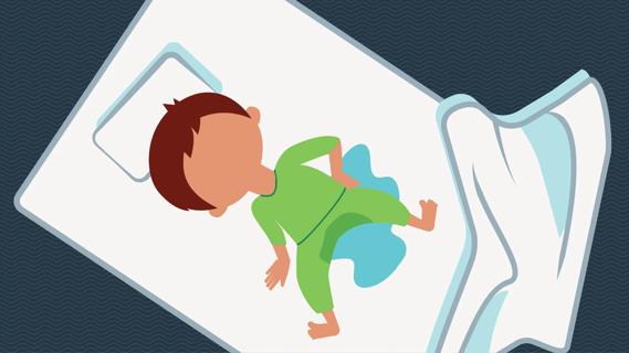 Child sleeping and wetting the bed, with wet sheets and pajamas