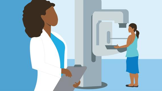 Person getting a mammogram under direction of radiologist