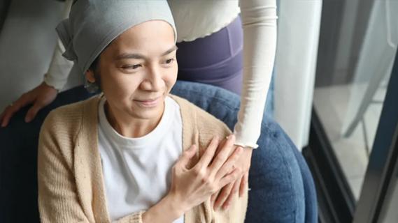 Patient holding loved one's hand
