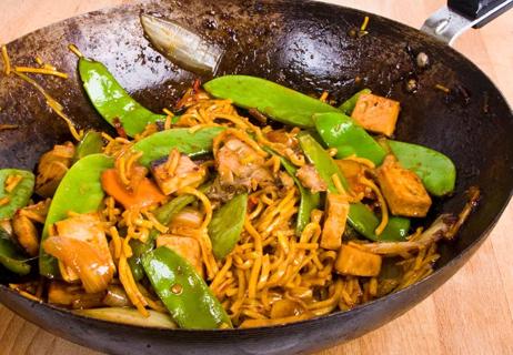 tofu noodles and pea pods in a tai peanut sauce