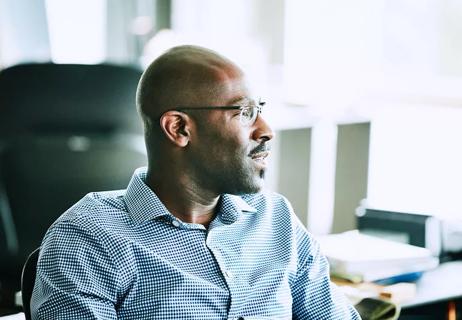 bald middle age man in office setting