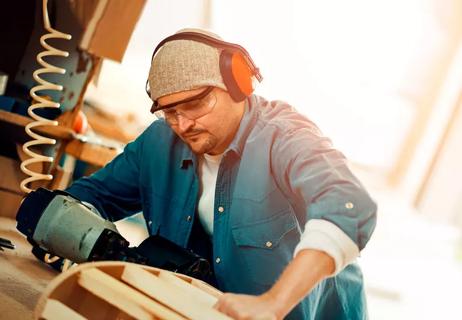 Construction worker wearing ear protection on the job