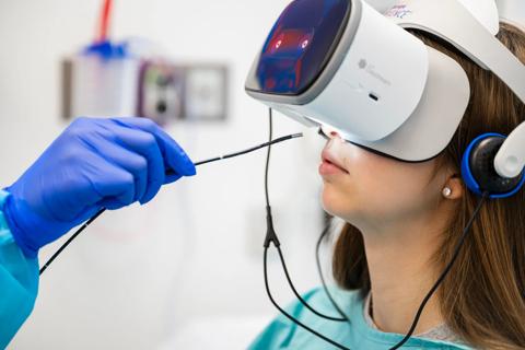 Girl wearing virtual reality headset, preparing for transnasal endoscopy