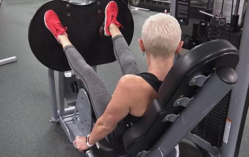 Woman working out at gym.