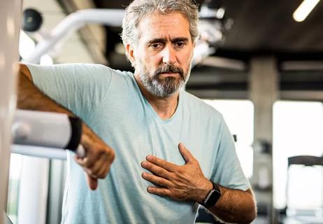 Older man exercising gets muscle pain in chest