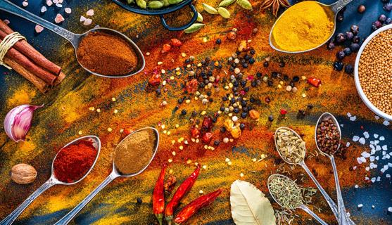 Various herbs and spices like paprika, tumeric, bay leaf, rosemary, cumin and peppercorns