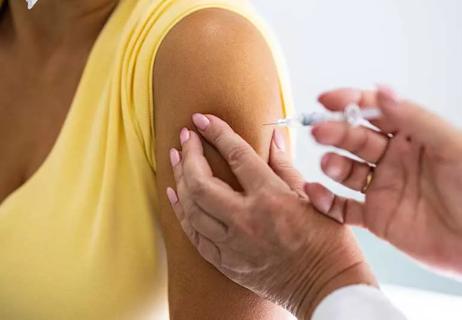 female getting a shot in arm