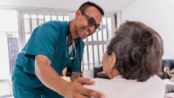 Nurse talking with elderly patient