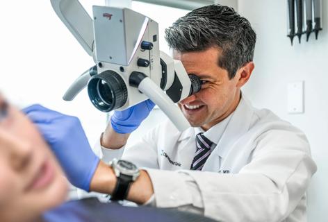 Dr. Doyle examining patient's ear