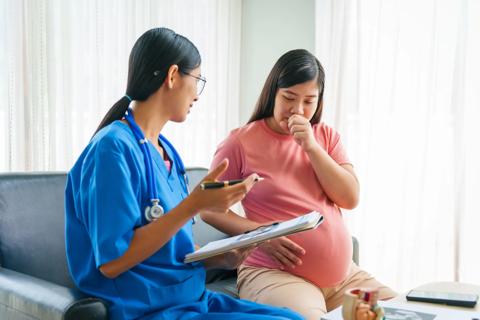 Pregnant woman at appointment with their healthcare provider