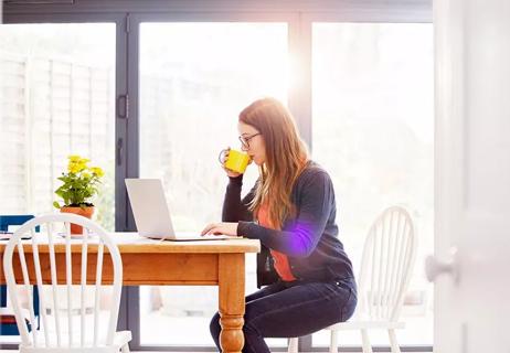 Woman sitting and working from home.