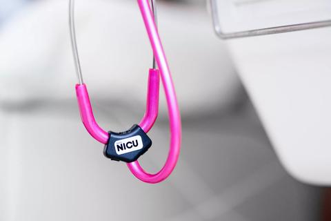 Pink stethoscope with NICU label