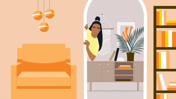 Person peeking into their living room from a doorway