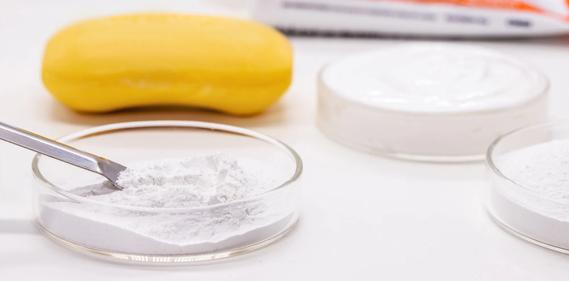 Different forms of soap, with a bar and powder