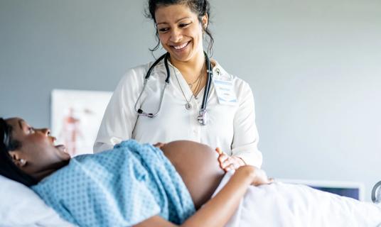 Pregnant person with nurse