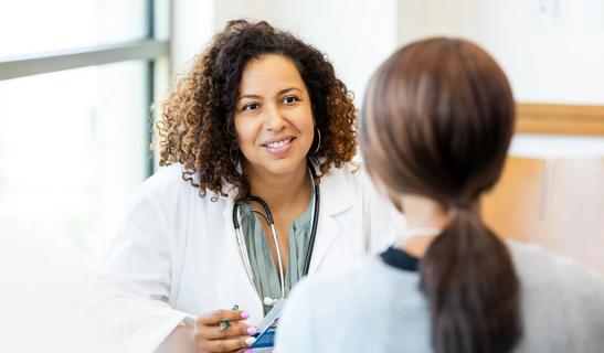 Healthcare provider talking to a patient