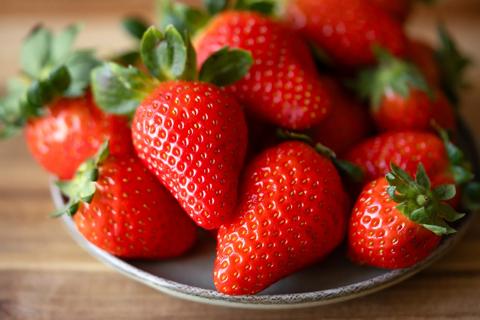 Bowl full of fresh whole strawberries