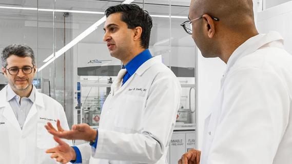 Dr. Kamath & colleagues in the lab