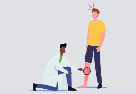 A healthcare worker observing someone's leg.