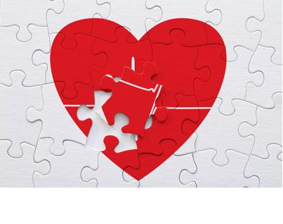 Red heart and pulse trace puzzle with missing piece