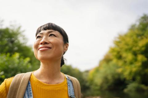 Happy person looking around while walking outside