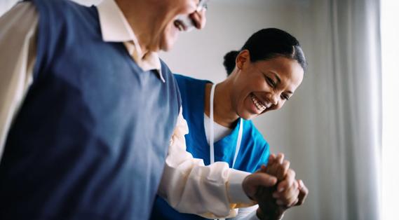 Nurse helping a patient at home