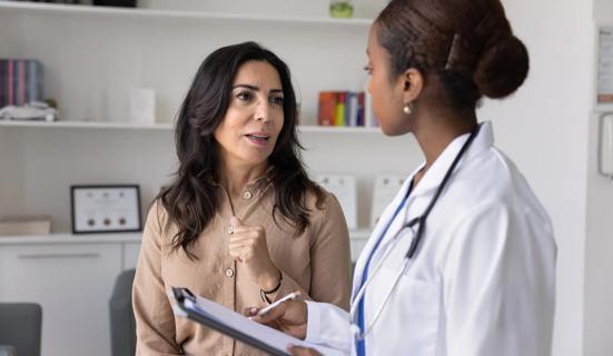 Female patient talking with healthcare provider