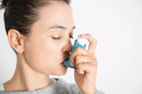Woman with inhaler