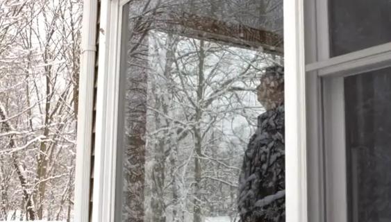 Man standing in window