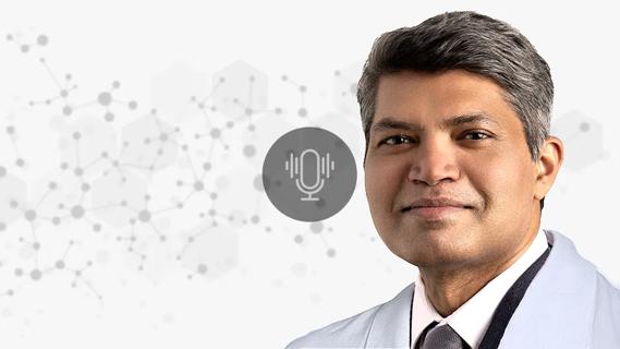 Dr. Jagan Pillai against a decorative background