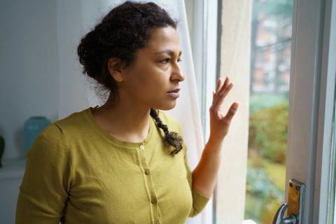 Woman looking out of window