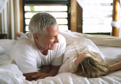 older couple relaxing in bed