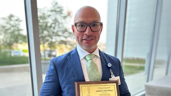 Guillermo Ortiz Blanco with recognition plaque