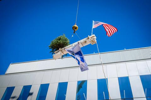 A ceremonial beam-lifting marked a major construction milestone in the Cleveland Innovation District.