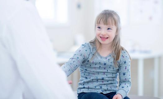 Doctor speaking with pediatric patient