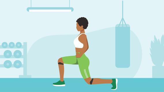 Person in a gym doing a lunge wearing a patella band on their knee