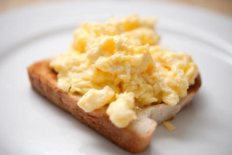 Plain scrambled eggs on a piece of toast