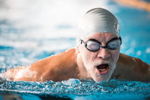 Adult swimming in pool