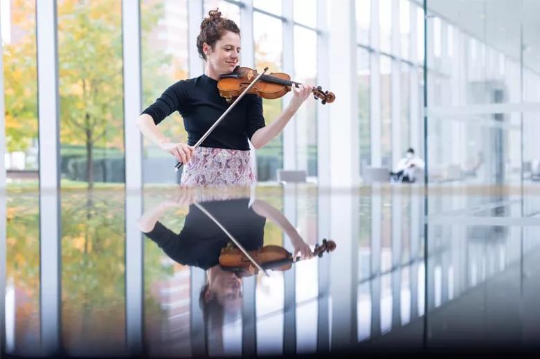 Woman playing musical instrument