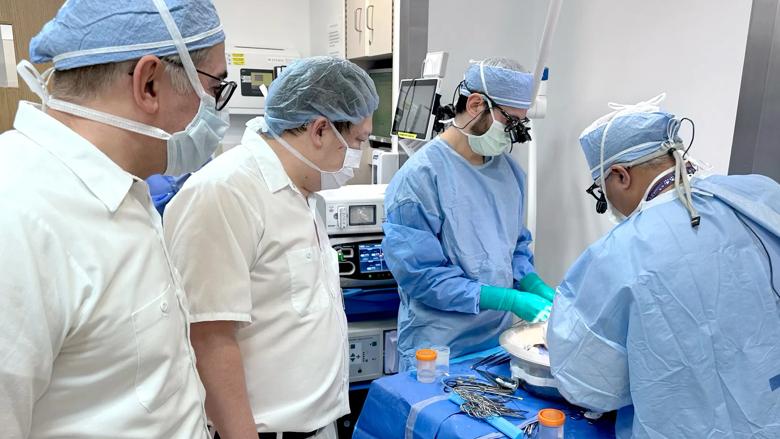 Surgeons observe preparation of the donor organs