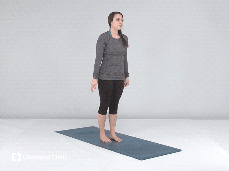 Person doing side plank yoga pose