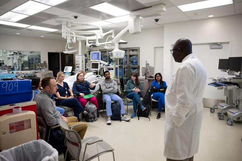 Students performing medical simulations in preparation for residency.