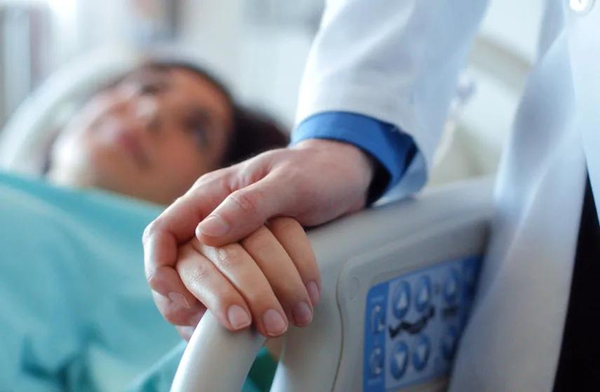 Doctor comforting a patient