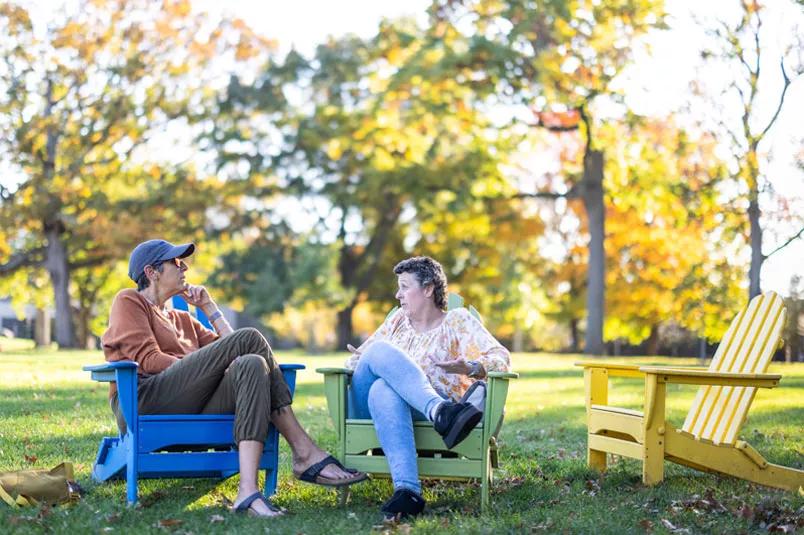 Women sitting in chairs outdoors