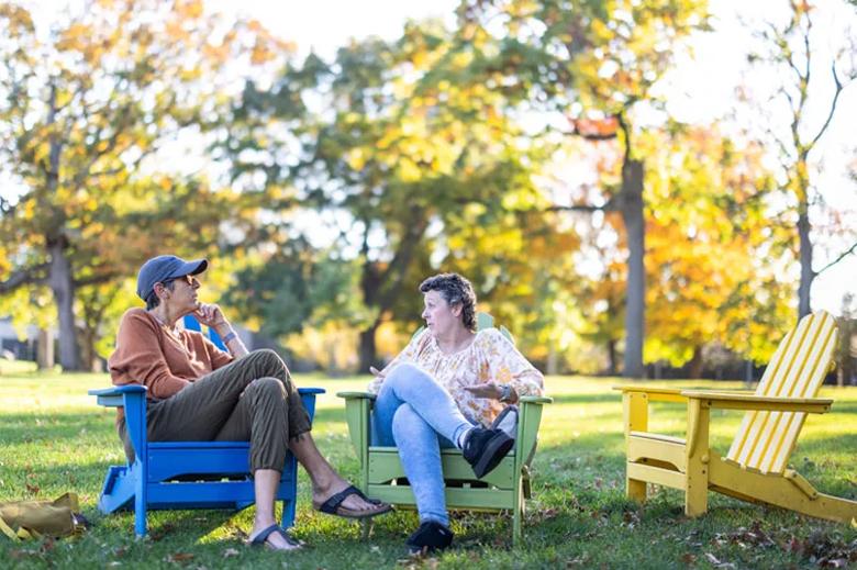 Women sitting in chairs outdoors